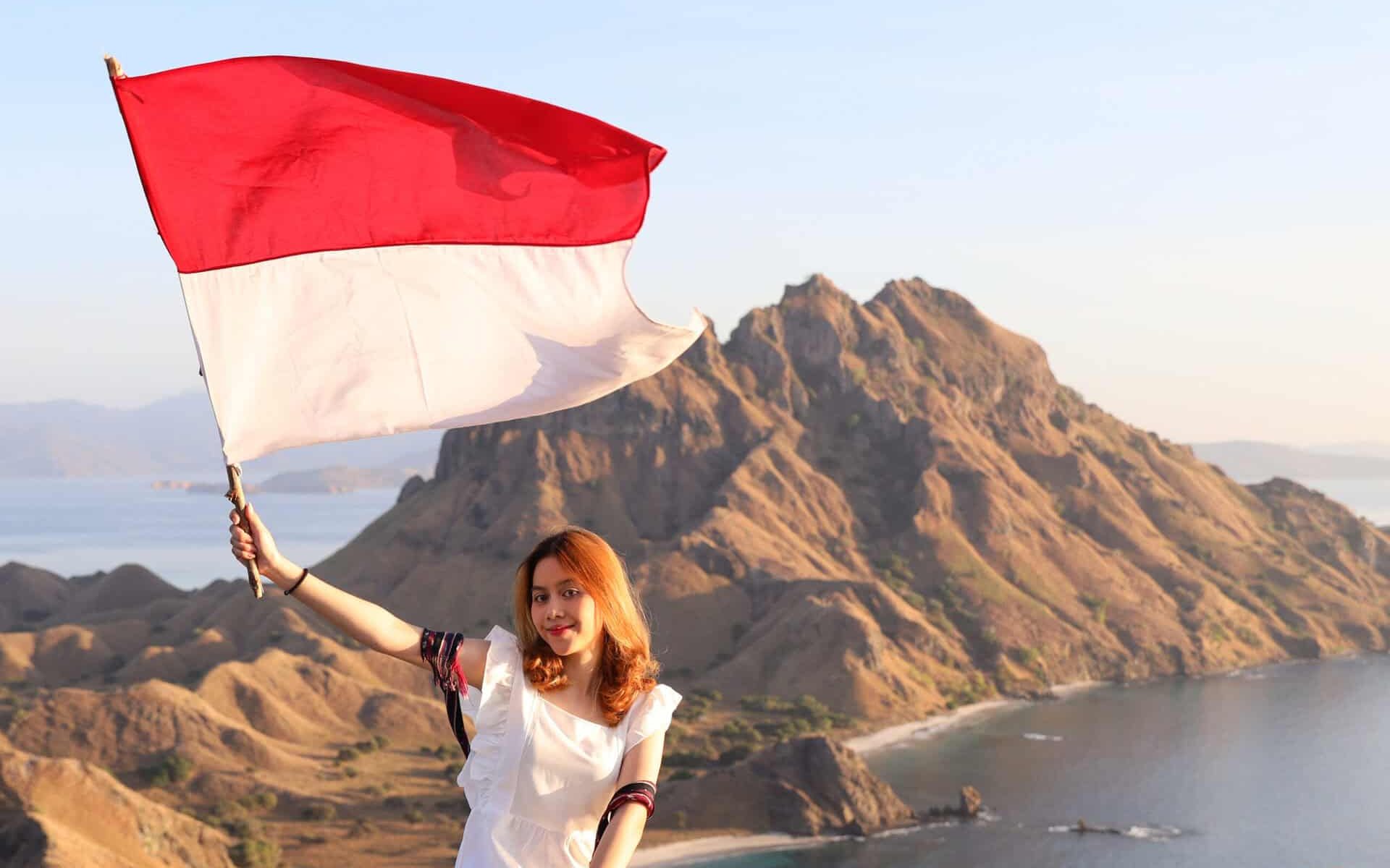 a-woman-on-top-of-hills-holding-indonesian-flag-ce-2026-01-07-06-41-28-utc