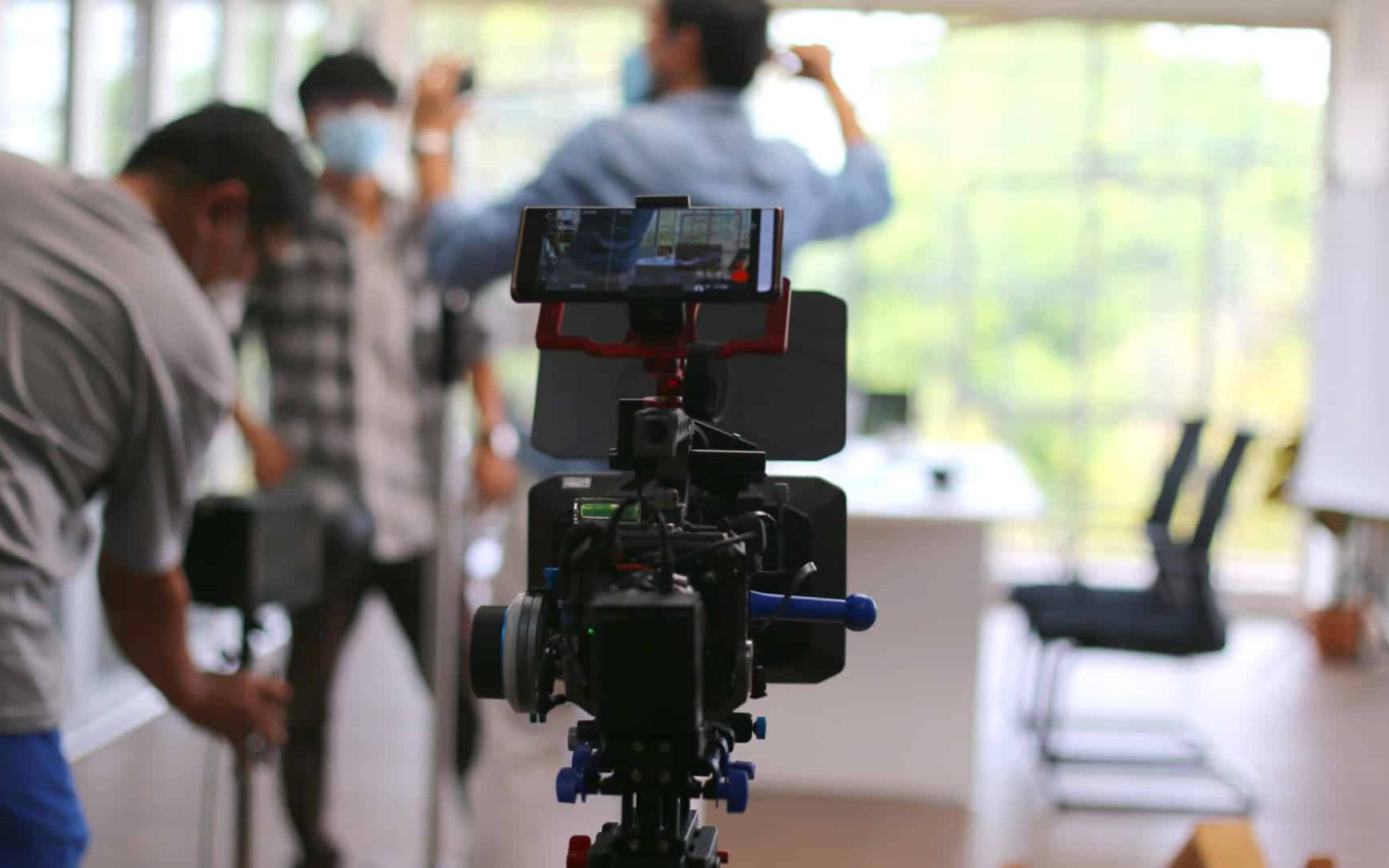 Selected focus on camcorder film broadcast against blurred background.